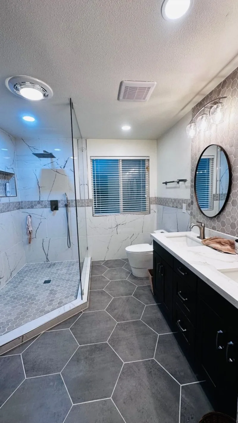 Bathroom after remodel: walk-in shower, vanity, and tile